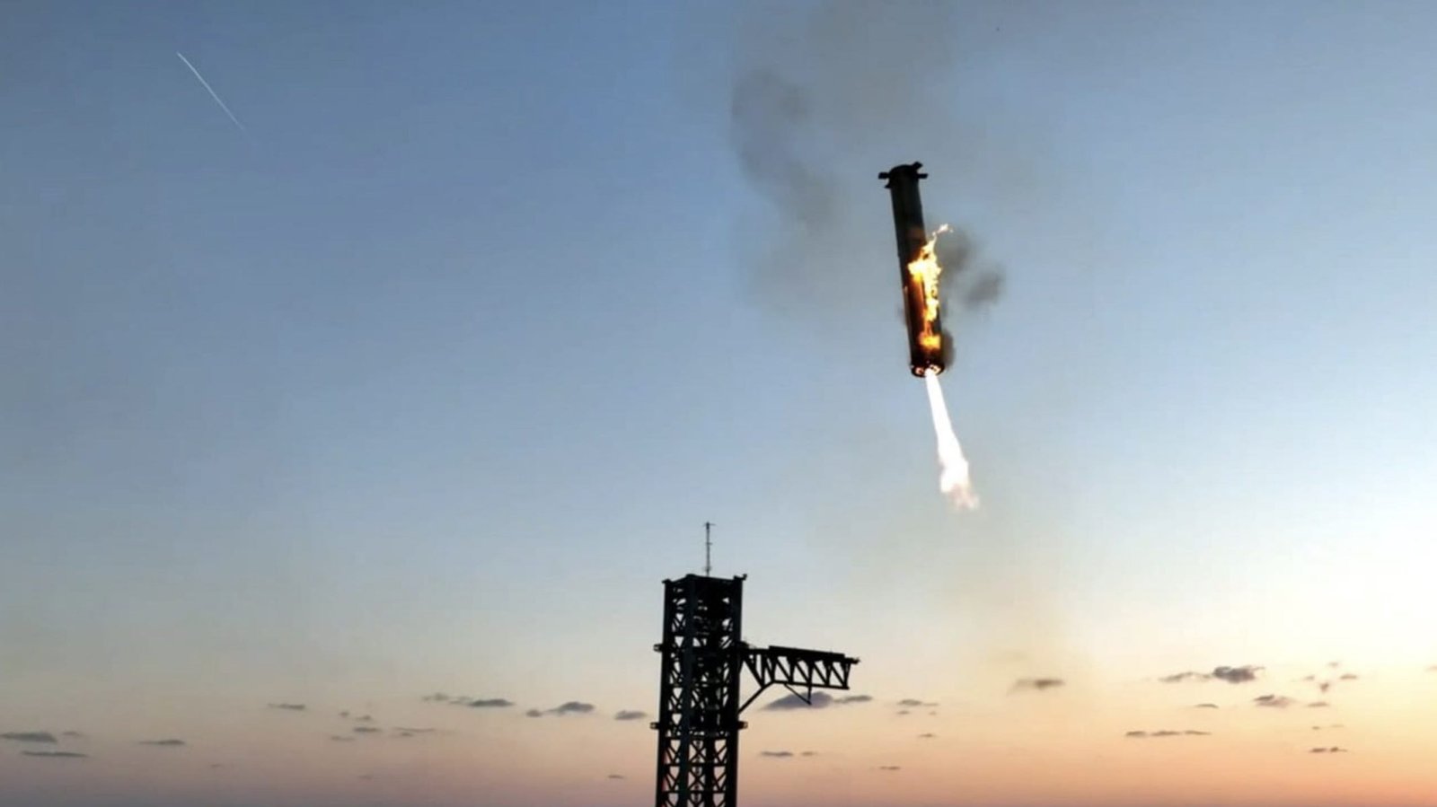 Mechanical arms Mechazilla catching SpaceX's Super Heavy booster mid-air